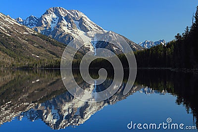 Grand Teton National Park, Rocky Mountains with Mount Moran reflected in Jenny Lake, Wyoming, USA Stock Photo