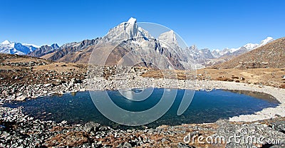 Mount Tabuche Peak mirroring in mountain lake, Nepal Stock Photo