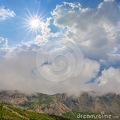 Mountain backbone in dense mist Stock Photo