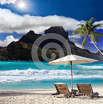 Mountain ,beach chairs and sea. Stock Photo