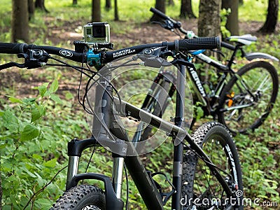 Mountain bicycles with GoPro 3+ BE mounted on handlebar in the f Editorial Stock Photo