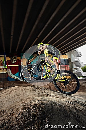 Mountain bike cyclist doing wheelie stunt on a mtb bike Editorial Stock Photo