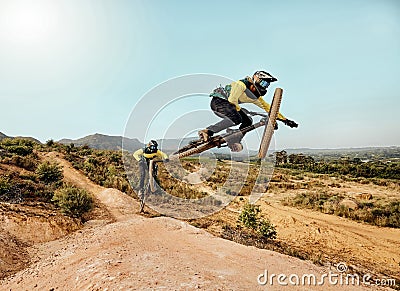 Mountain bike, extreme sports jump and outdoor dirt track for friends on cycling adventure in nature. Bicycle team ride Stock Photo