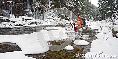 Mountain bike in the winter in the mountains Stock Photo