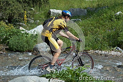 Mountain biker and creek Stock Photo