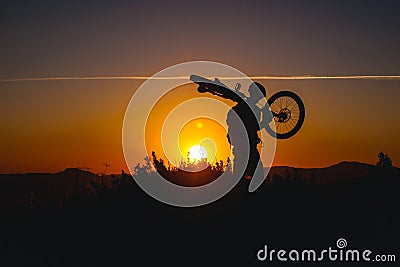 Mountain biker silhouette in sunset Stock Photo
