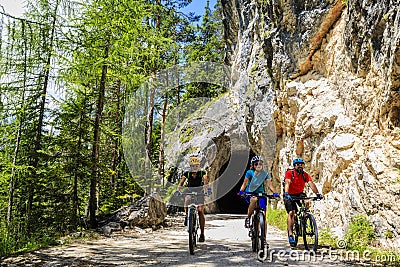 Mountain biking family with bikes on track, Cortina d`Ampezzo, D Stock Photo