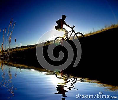 Mountain Biking Reflection Stock Photo