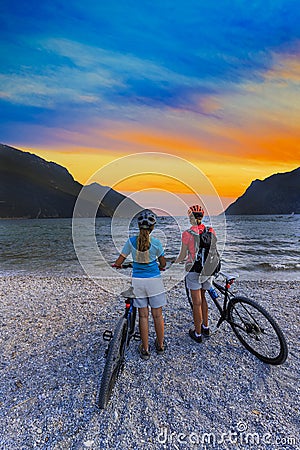 Mountain biking woman and young girl. Stock Photo