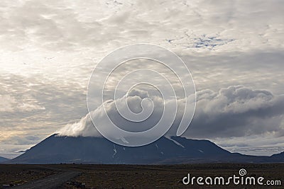 Mountain in the clouds at KerlingarfjÃ¶ll Region in Iceland Stock Photo