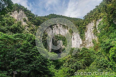 Mountain with deer cave entrance at tropical jungle forest at the Mulu national park Stock Photo