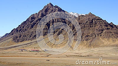 Mountain with farm near Hofn in east fjords in Iceland Stock Photo