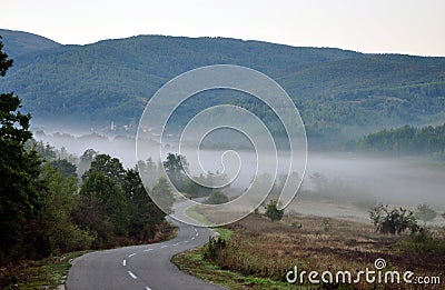 Mountain foggy road Stock Photo