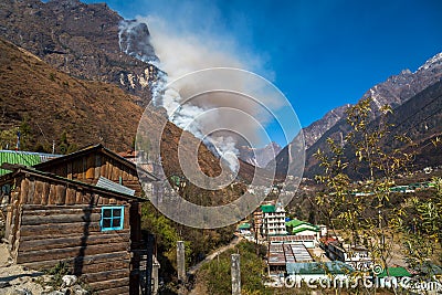 Mountain forest fire burning on a hill in Lachung Sikkim. Stock Photo