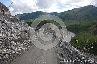 Mountain gravel road turn left Stock Photo