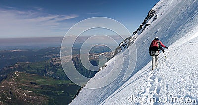 Mountain guide and client on a steep north face slope heading towards the summit with a great view of the surrounding mountain lan Editorial Stock Photo