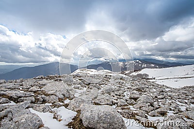 Mountain half snow half rocks Stock Photo