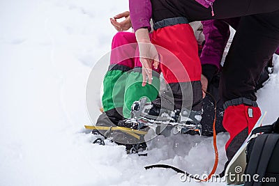 Mountain hiking gear being put on by a hiker Stock Photo