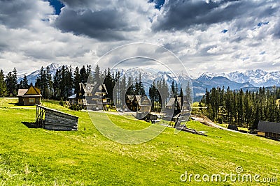 Mountain homes in glade with beautiful mountain views. Editorial Stock Photo