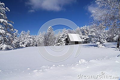 Mountain house in snow Stock Photo