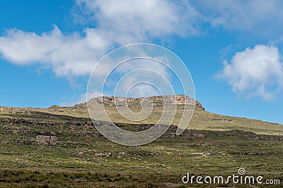 Mountain hut and Crows Nest Cave seen from Tugela Falls Stock Photo