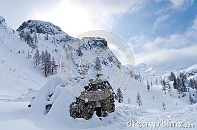 Mountain hut - shelter for mountaneers from the snow storm in winter Stock Photo