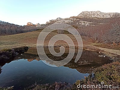 Reflections, Mountain lake in the Cordillera Cantabrica. Espinosa de los Monteros in the north of Burgos Stock Photo