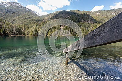 mountain lake forest wooden railing Fernsteinsee Tyrol Stock Photo