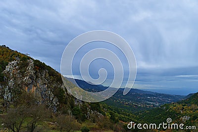 Mountain landscape in altitude in Lebanon green mountain with a storm in a far end Stock Photo