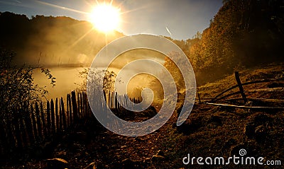 Mountain landscape with autumn morning fog at sunrise Stock Photo