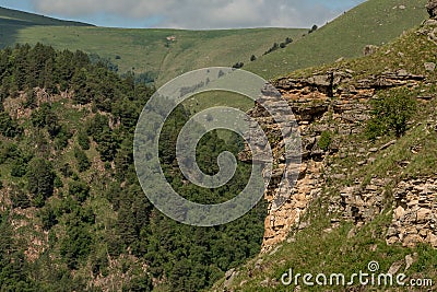 Mountain landscape with deep gorge. mountains, green pass. Picturesque scenery with beautiful hills and rocks. Colorful view to Stock Photo