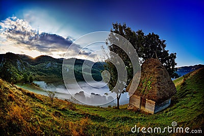 Mountain landscape in foggy morning in Romania Stock Photo