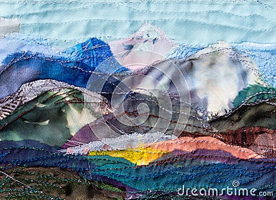 Mountain landscape hand-stitched with patchwork Stock Photo