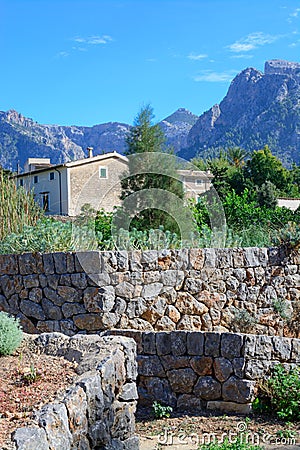 Mountain landscape with house and drystone wall Stock Photo