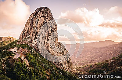 Mountain landscape with large rock formation. Roque de Agando. Hiking trail with sunset view of La Gomera, Canary Islands Stock Photo