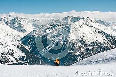 Mountain landscape and man. The skier starts the descent from the mountain Stock Photo
