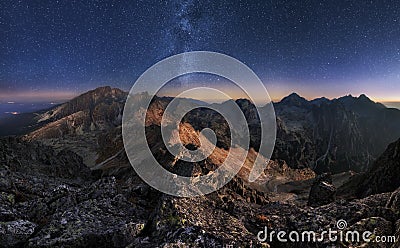Mountain landscape with night sky and Mliky way, Slovakia Tatras from peak Slavkovsky stit Stock Photo