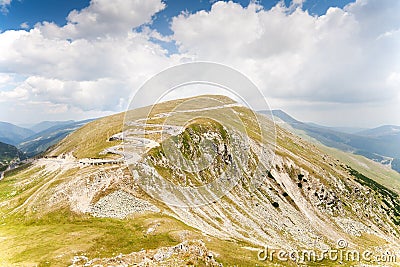 Mountain landscape with road in background Stock Photo