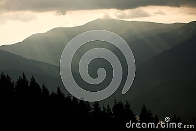 Mountain landscape, the sun rays through the clouds Stock Photo