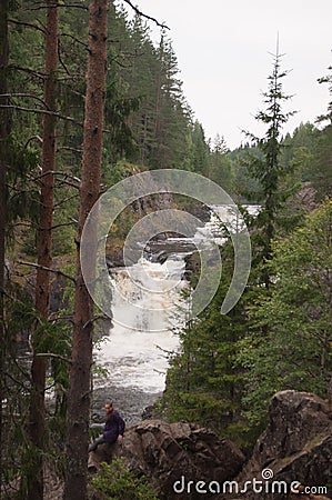 Mountain low waterfall with a rapid current Stock Photo