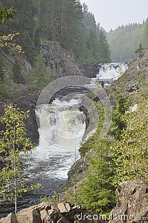 Mountain low waterfall with a rapid current Stock Photo