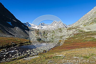 Mountain mirror lake in autumn colors scenic view. Fall in the Altai Mountains, Russia Stock Photo