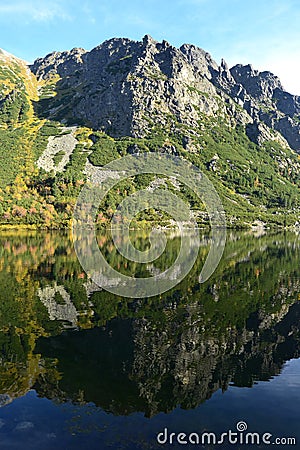 Mountain nature blue sky green park wood clouds lake reflex nice Stock Photo