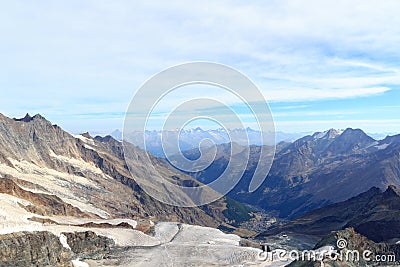 Mountain panorama view of Bernese Alps and village Saas-Fee seen from Allalinhorn, Switzerland Stock Photo