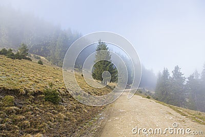 Mountain gravel road leading to a cabana Stock Photo