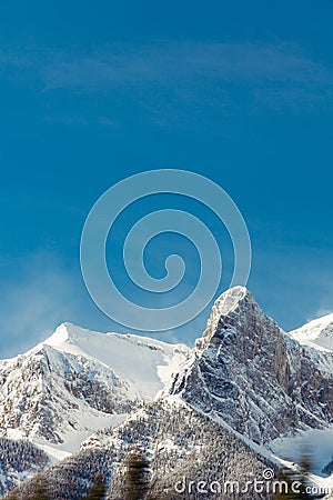 Snowy Rocky Mountains and Blue Sky, Banff, Alberta Stock Photo