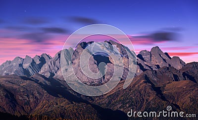 Mountain peak lighted by moonlight in autumn at night Stock Photo