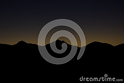 Mountain Peaks At Dawn Before Sunrise Stock Photo