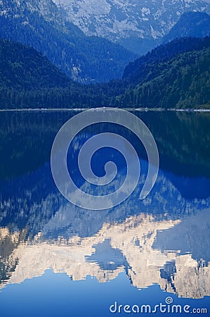 Mountain peaks reflecting in lake Stock Photo