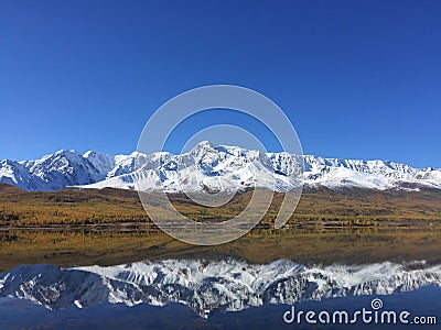 Mountain Ridge lake reflection. Amazing mountain landscape. Altai Mountains. Kurai steppe. Dzhangyskol lake Stock Photo